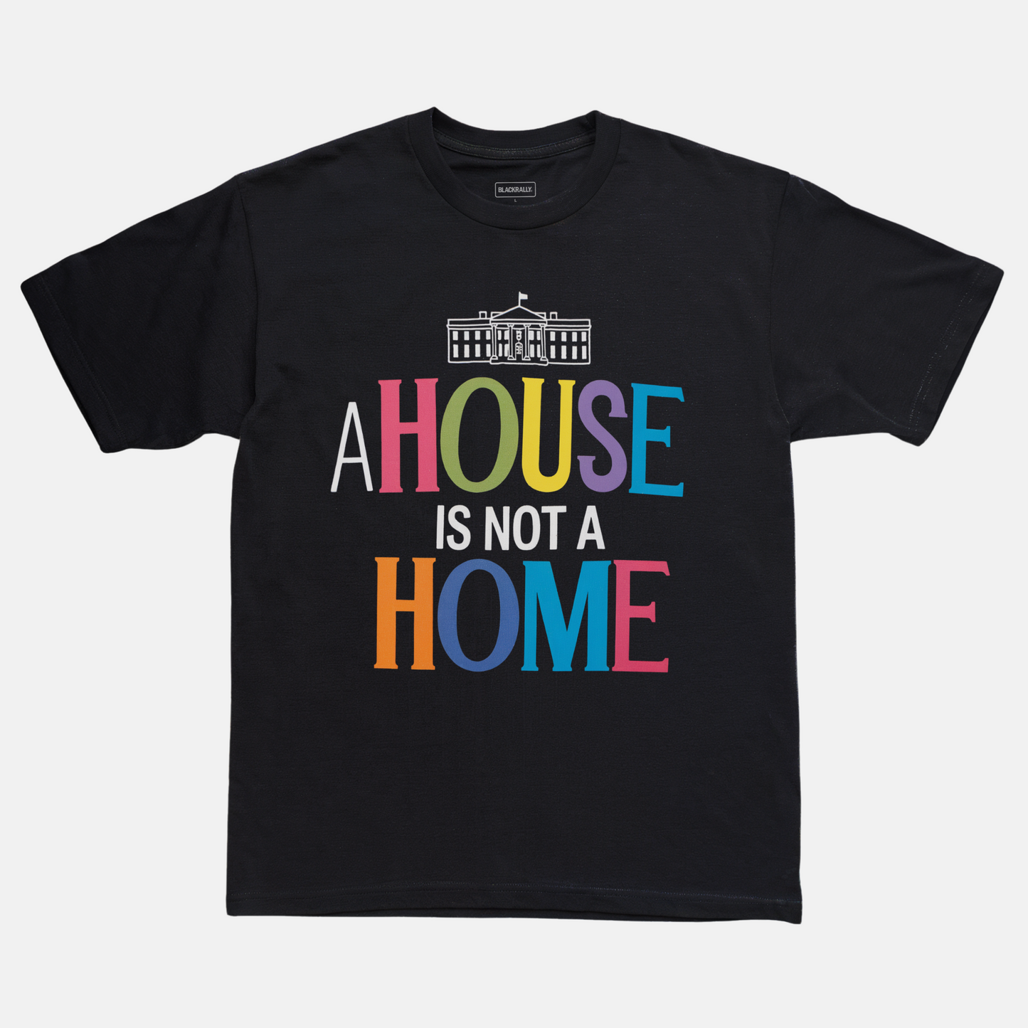 Black t-shirt with colorful text 'A HOUSE IS NOT A HOME' on a white background
